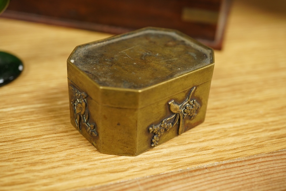 A carving of a Tudor rose-30cm wide, a brass bound box, small brass box, two eye baths, a green malachite ashtray etc